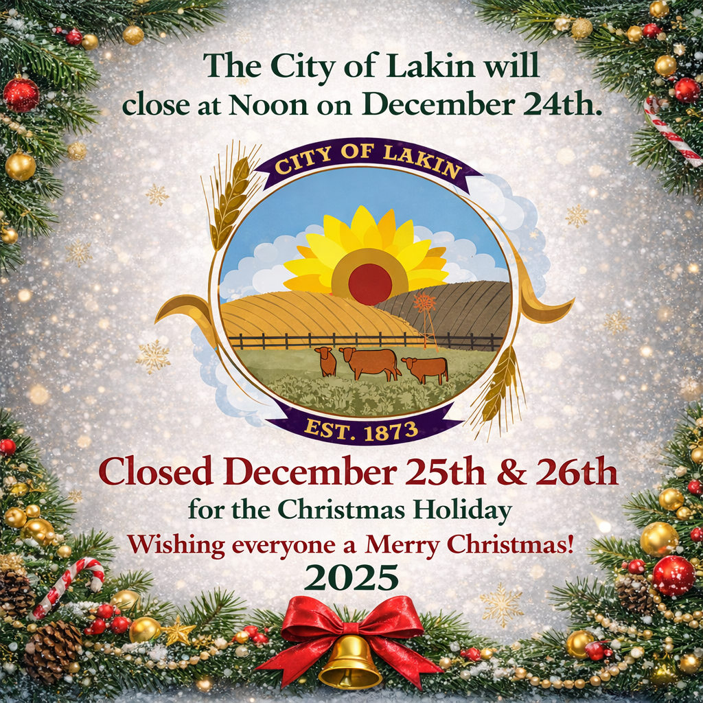 Festive square holiday graphic for the City of Lakin featuring the city logo centered within a snowy background framed by evergreen garland, ornaments, and a red bow. Text reads: “The City of Lakin will close at noon on December 24. Closed December 25 & 26 for the Christmas Holiday. Wishing everyone a Merry Christmas! 2025