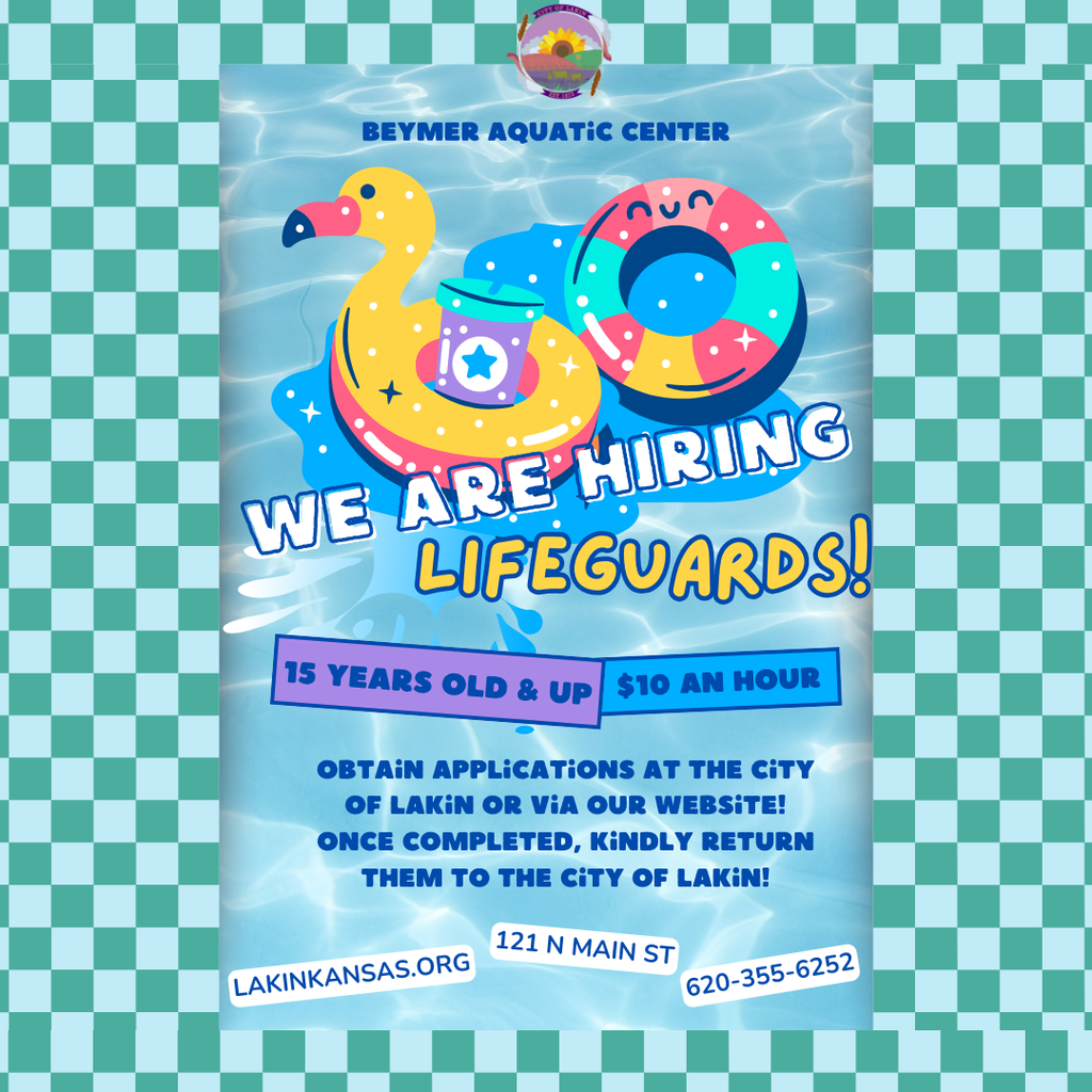 Colorful hiring flyer for Beymer Aquatic Center featuring a water background with a yellow flamingo float and a multicolored swim ring. Large text reads “We Are Hiring Lifeguards!” Details include: “15 years old & up” and “$10 an hour.” Additional text says applications can be obtained at the City of Lakin or online and should be returned once completed. Contact information at the bottom includes lakinkansas.org, 121 N Main St, and phone number 620-355-6252. The design is framed with a turquoise checkerboard border.