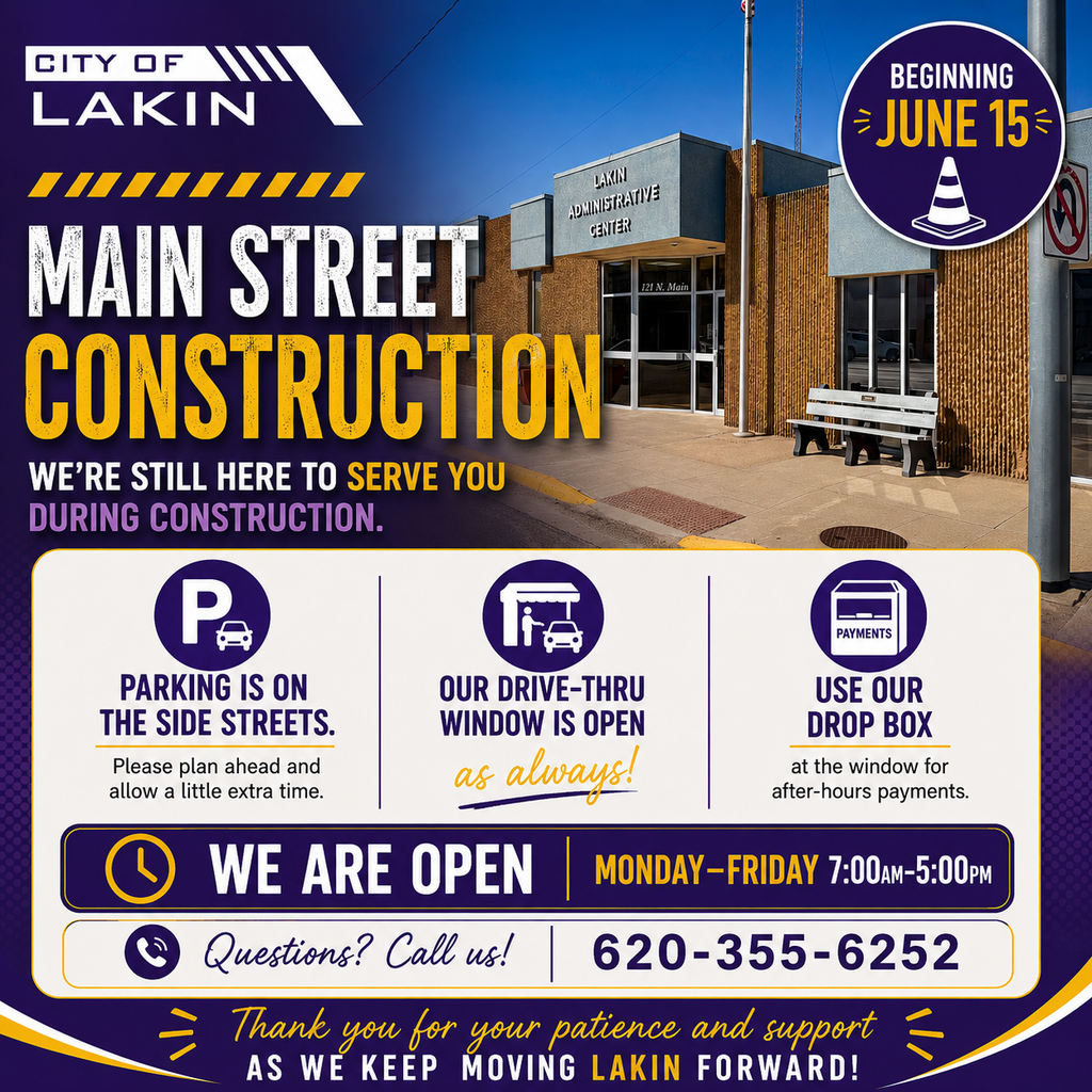 Square informational graphic for the City of Lakin about Main Street construction beginning June 15. The graphic features a photo of the Lakin Administrative Center building as the background, with bold purple and yellow construction-themed text reading “Main Street Construction” and “We’re Still Here to Serve You During Construction.” A circular badge notes construction begins June 15. Information panels explain that parking is available on side streets, the drive-thru window remains open as usual, and the drop box at the window can be used for after-hours payments. Office hours are listed as Monday–Friday, 7:00 AM–5:00 PM, with contact information provided: 620-355-6252. The graphic closes with a thank-you message for patience and support as Lakin moves forward during Main Street improvements.
