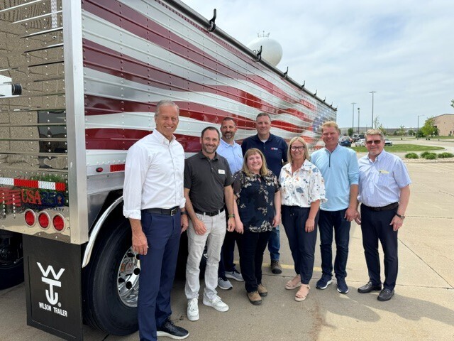 A photo of Senator John Thune with Lennox residents and representatives of Wilson Trailer