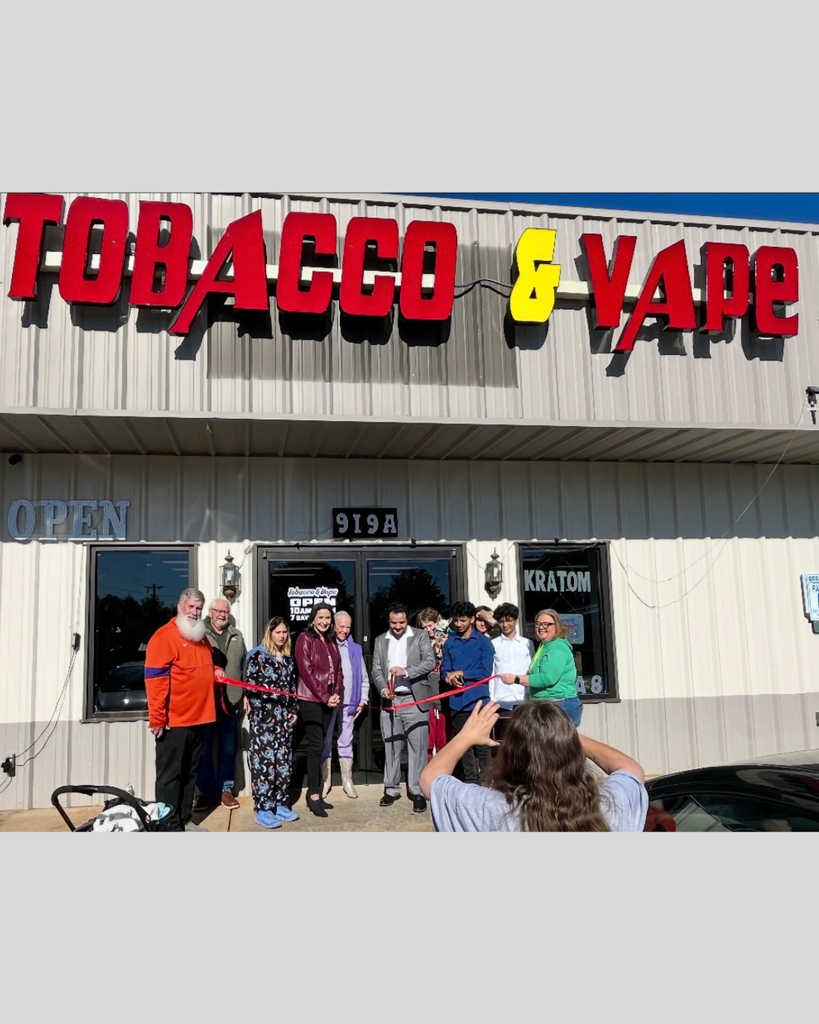Ribbon cutting Vape store