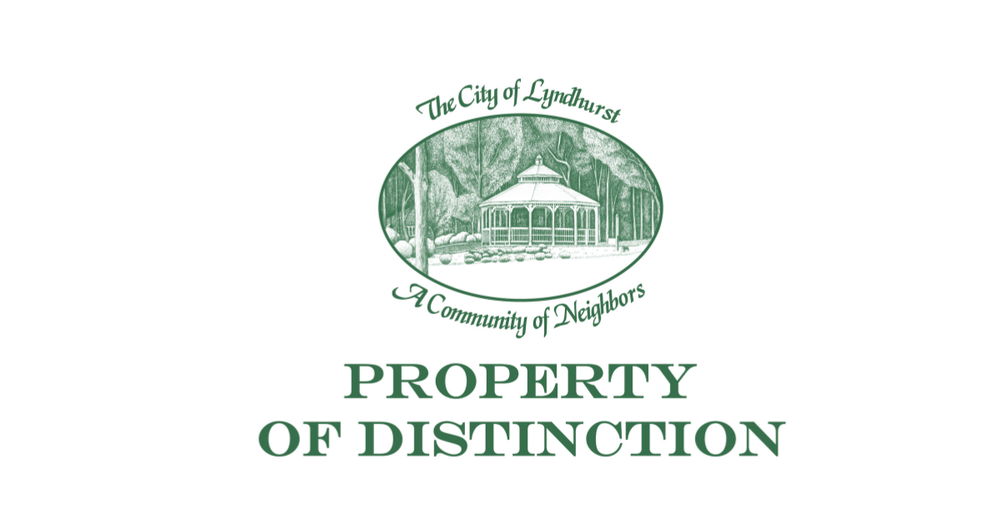 City logo with Property of Distinction in green letters