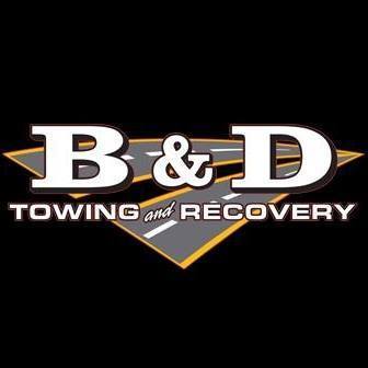 B & D Towing and Recovery logo with large white “B & D” lettering over a black, gray, and gold diamond-shaped background. Text below reads “Towing and Recovery.”