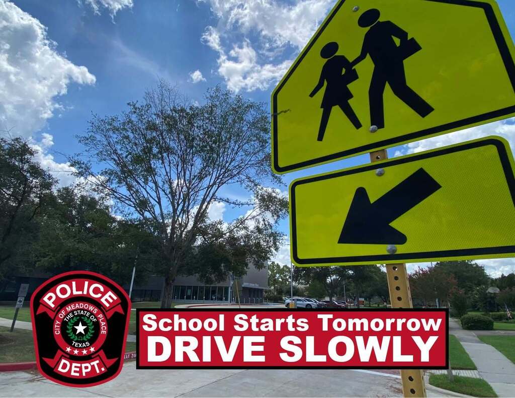 School crossing reminder graphic featuring a fluorescent yellow-green pedestrian crossing sign against a blue sky. The Meadows Place Police Department badge appears beside text reading: “School Starts Tomorrow. Drive Slowly.”