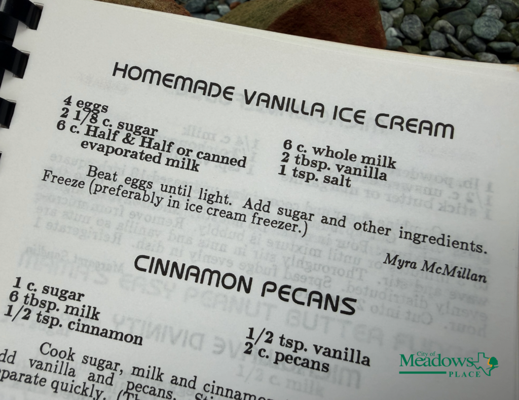 Close up of the Meadows Home and Garden Club cookbook open to a homemade vanilla ice cream recipe, with a cinnamon pecans recipe partially visible below.