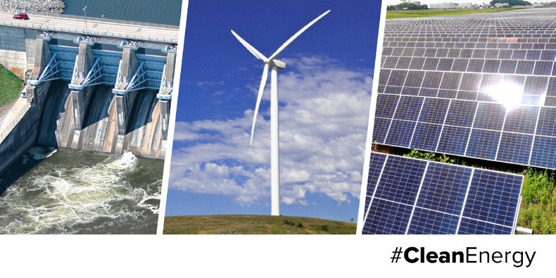 A dam, a windmill, and solar panels