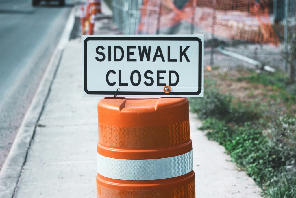 Sidewalk closed on construction cone