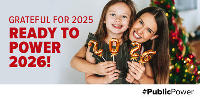 A woman and child holding up 2026