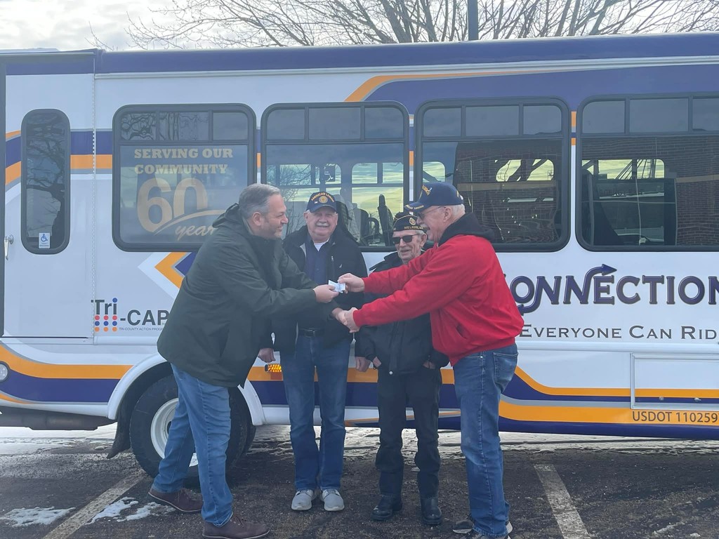 Council member Mark niehoff receiving a donation.