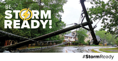 a light pole knocked over on a road from a storm for be storm ready
