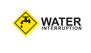 A  sign with a dripping faucet with the words Water Interruption 