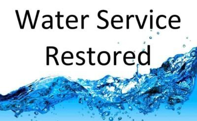 the words water service restored with water