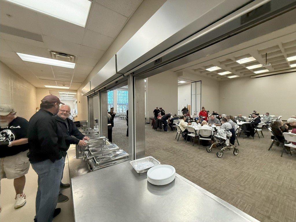 Veterans enjoying a free meal on Veterans Day