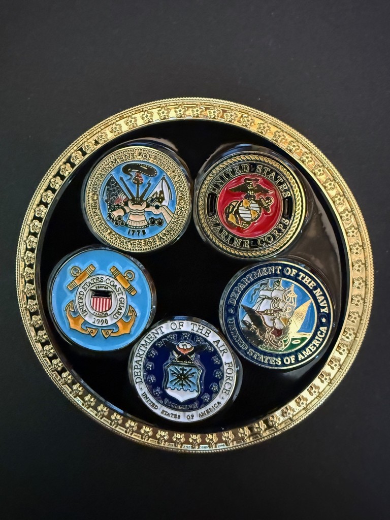 One side of a Coin with the Branches of the Military on them