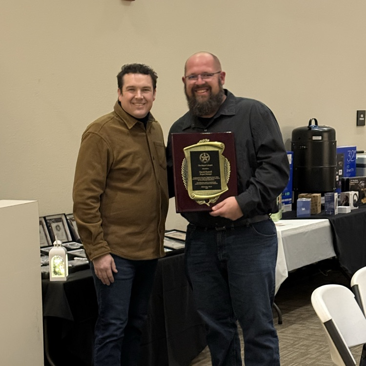 Pictured are Mustang Mayor Michael Ray and David Russell.