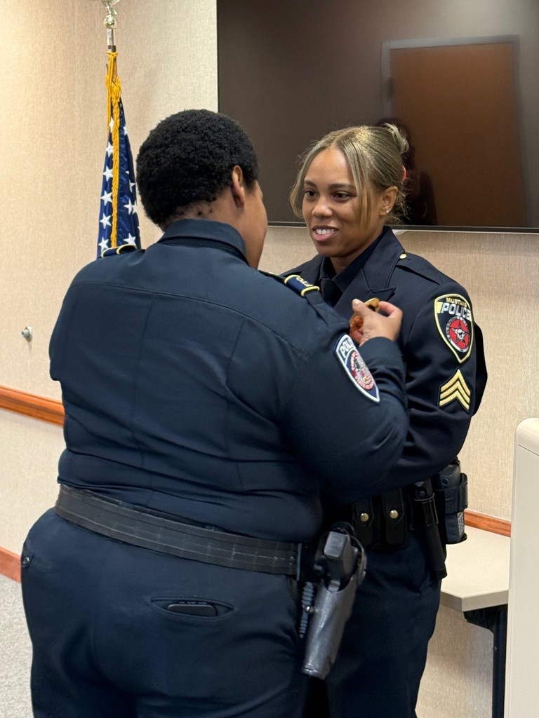 Officer Jazreale Wright being pinned by her sister, Travonna 