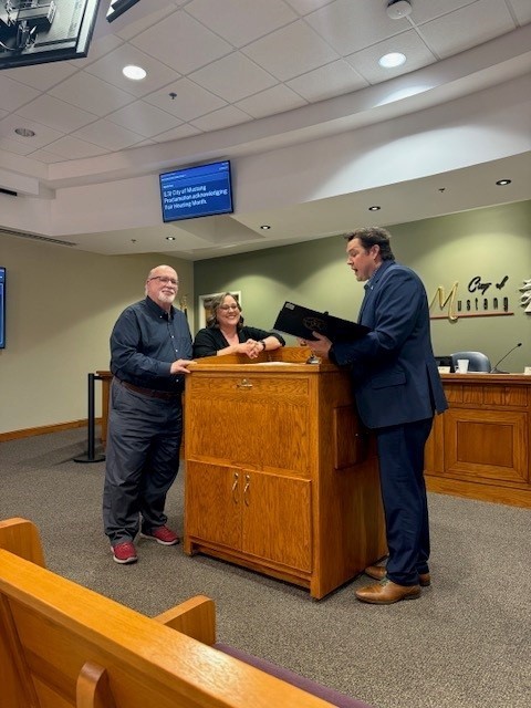 Glen Cosper & Carrie Sharp of  Oklahoma Realtors Assoc.receiving proclamation from Mayor Ray