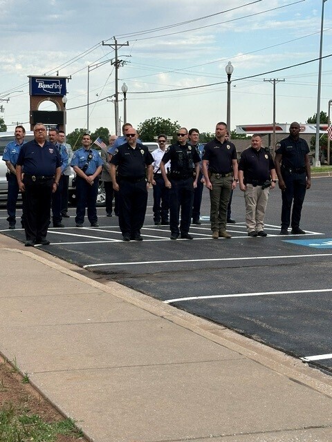 Members of the Mustang Police and Fire Departments attending the Peace Officer Memorial Ceremony