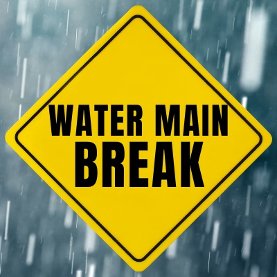 water main break yellow sign