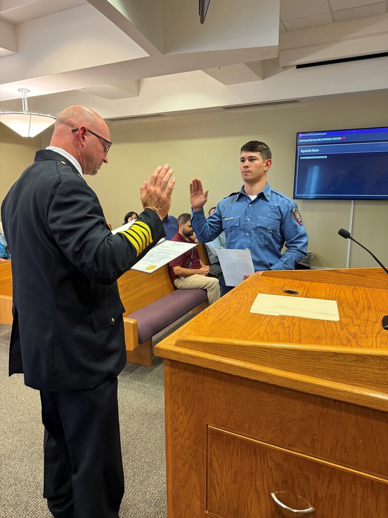 Chief Carruth administering the Oath of Office to Jaxon Flaming