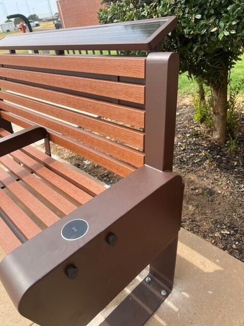 A close up view of a new solar powered bench