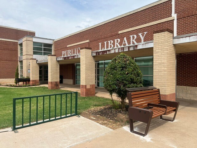 A photo of a new bench outside of the library