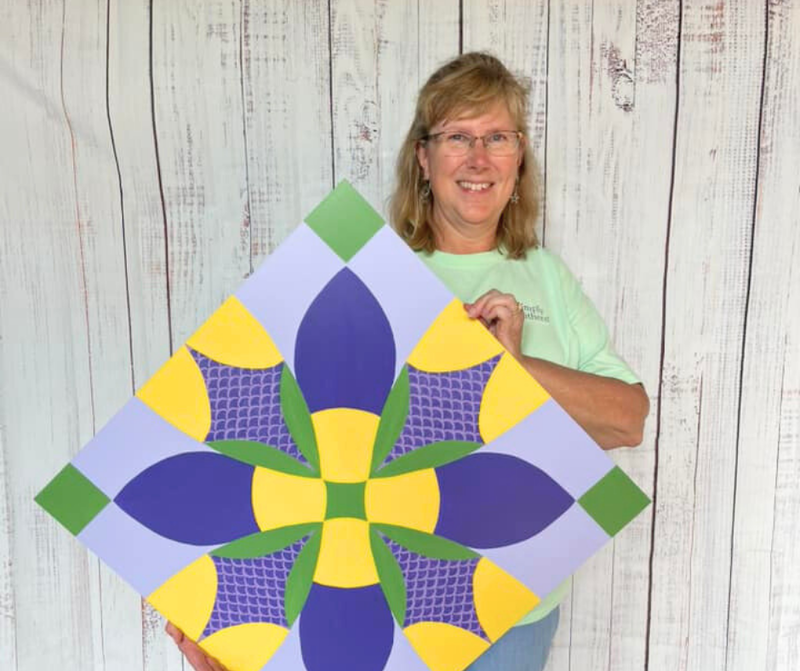 Woman holding a painting
