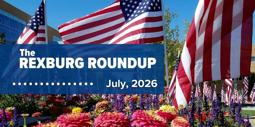 Rexburg roundup: July 2026 - photo of 3 large and many small American flags and zinnias on BYUI campus with skybridge and buildings in the background.