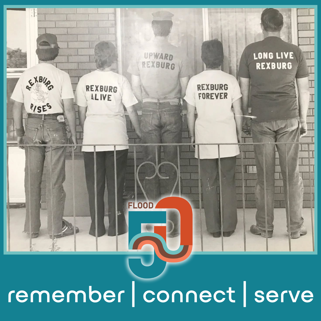 B&W image of 5 adults stand with their backs to the camera behind an iron railing, in front of a brick house front, all wearing shirts that say "rexburg rises", "rexburg alive" "upward rexburg" "rexburg forever" and "long live rexburg". there's the Flood 50 logo and words "remember connect serve at the bottom of the frame.