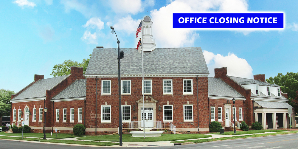 Office closing notice with photo of City Hall
