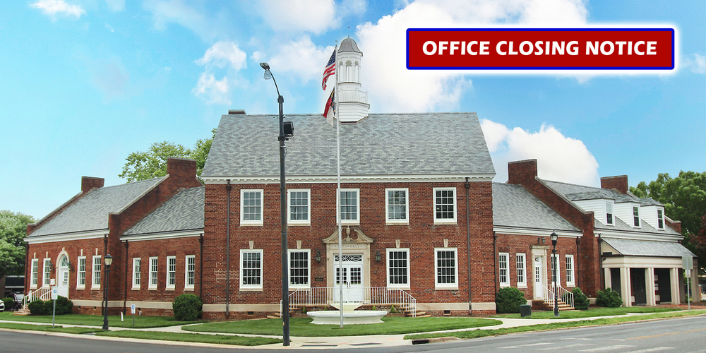 Office closing notice with photo of City Hall