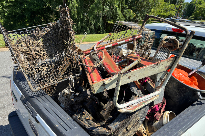 Truck load of trash and debris collected from creek cleanup event