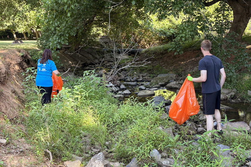 Volunteers collecting trash from the creek