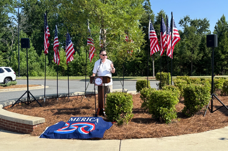 The Mayor giving remarks at the podium during the ceremony
