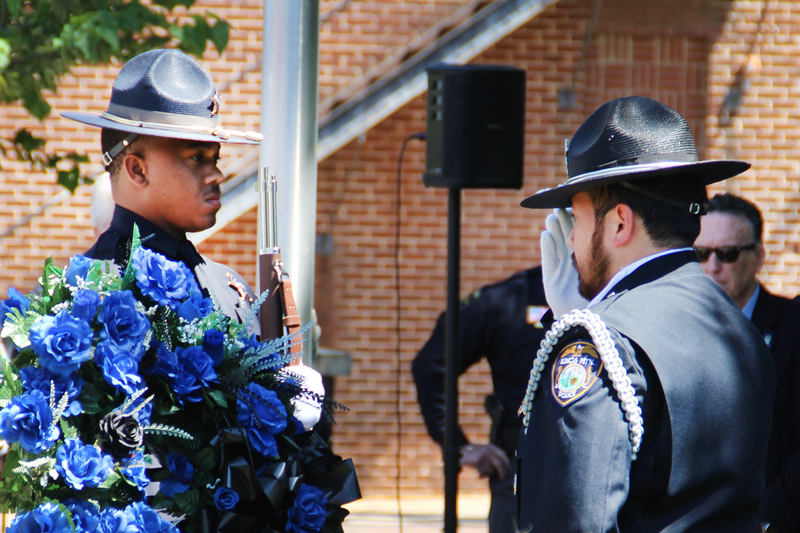 Officer saluting another officer at the National Police Week Memorial Service