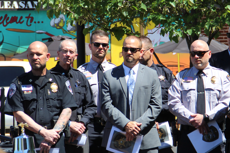 Law enforcement officers listening to speakers at the National Police Week Memorial Service