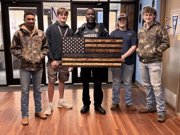 Highschool students with Officer Brown
