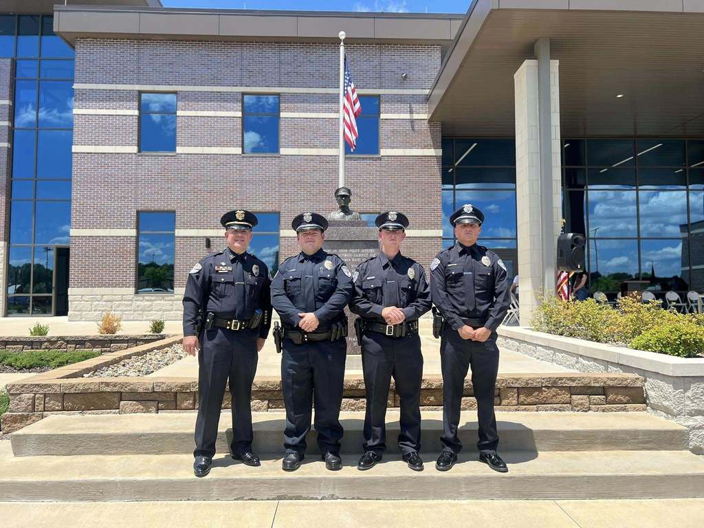 2 graduates with Chief Hagar and Ofc. Bormann
