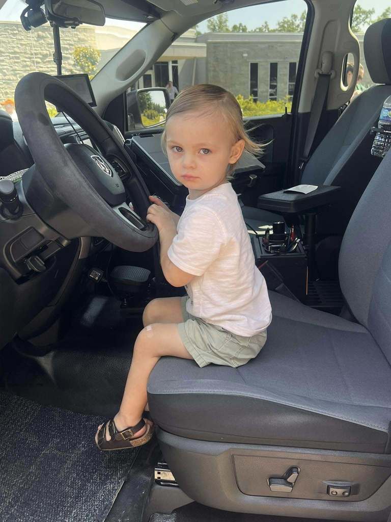 Kiddo in the police truck.