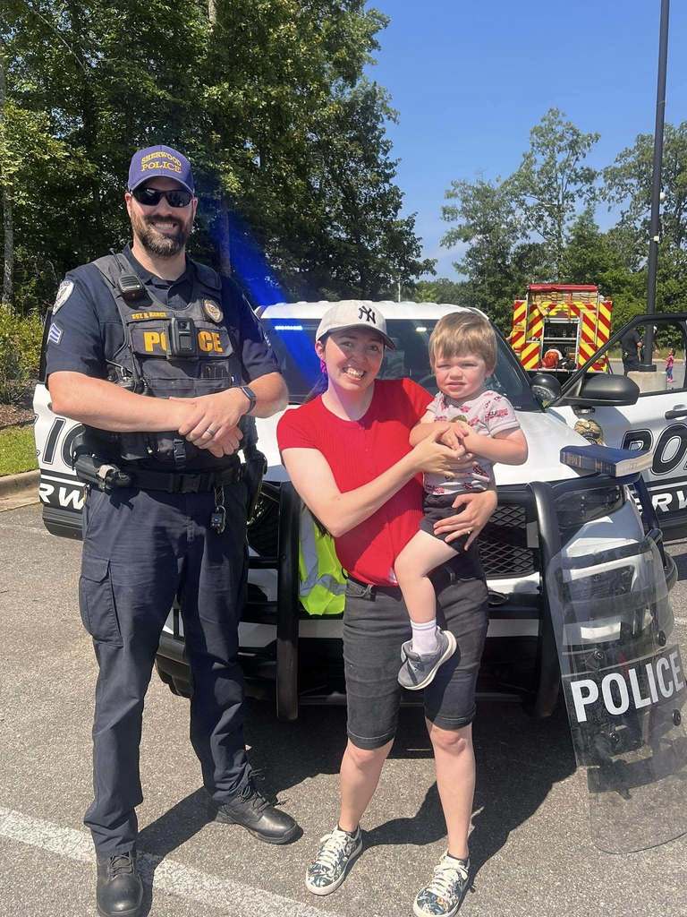 Officer Nance and a family at Touch a Truck. 