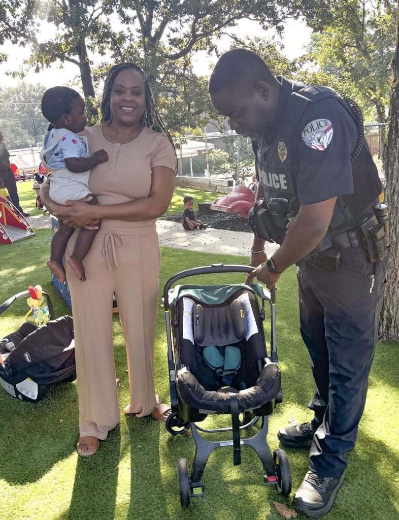 Officer Brown setting up a car seat