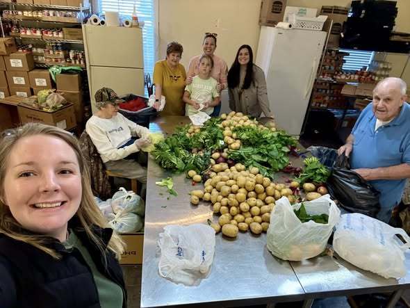 Officer assisting with drivers picking up food