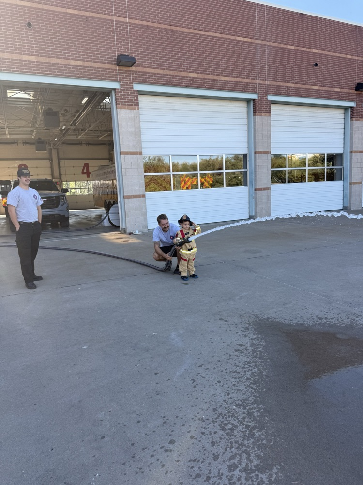 little boy visiting the fire station