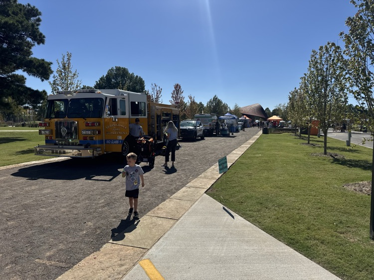 kid beside fire truck