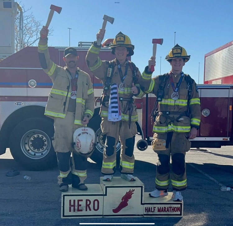 firefighters on trophy podium