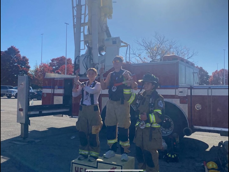 firefighters with trophies after marathon race