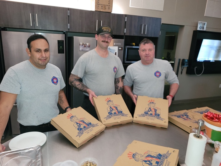 firefighters with pizza