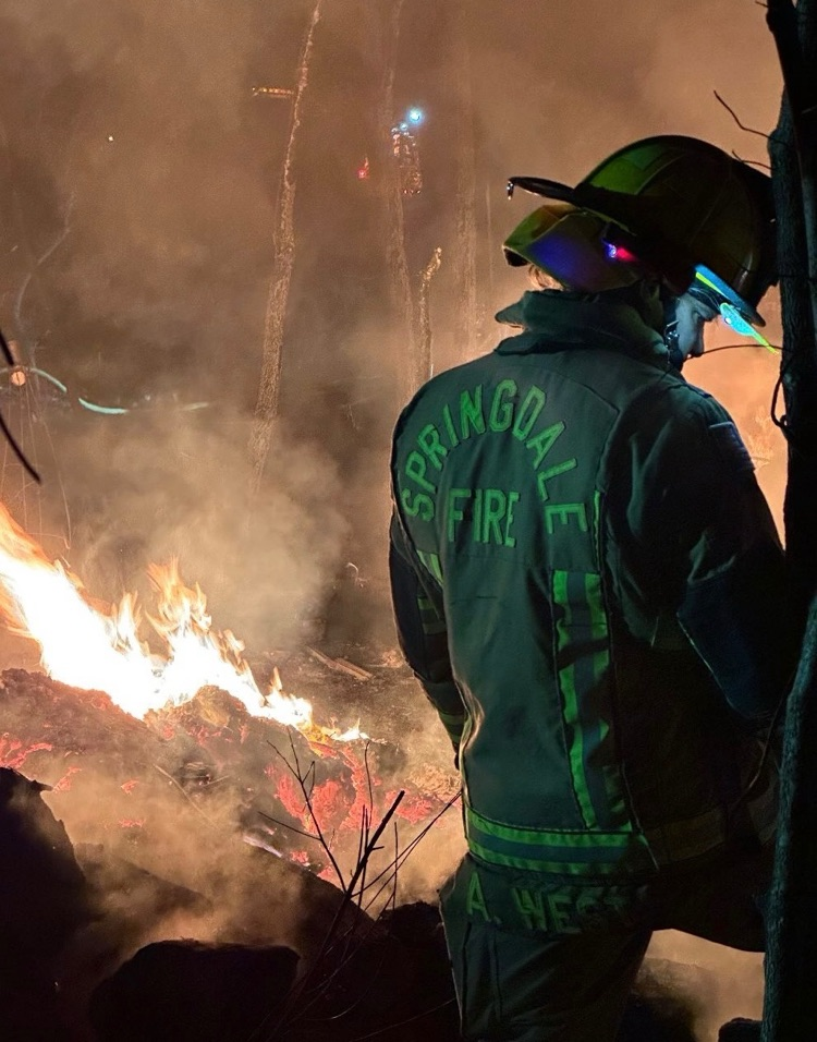 firefighter working on a grass fire