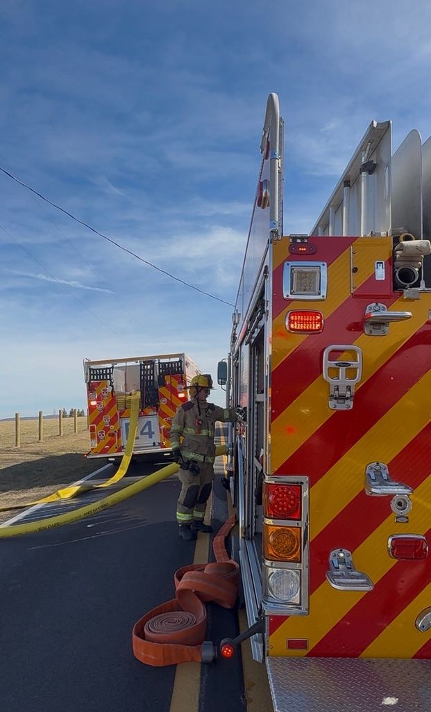 firefighter pumping a fire engine