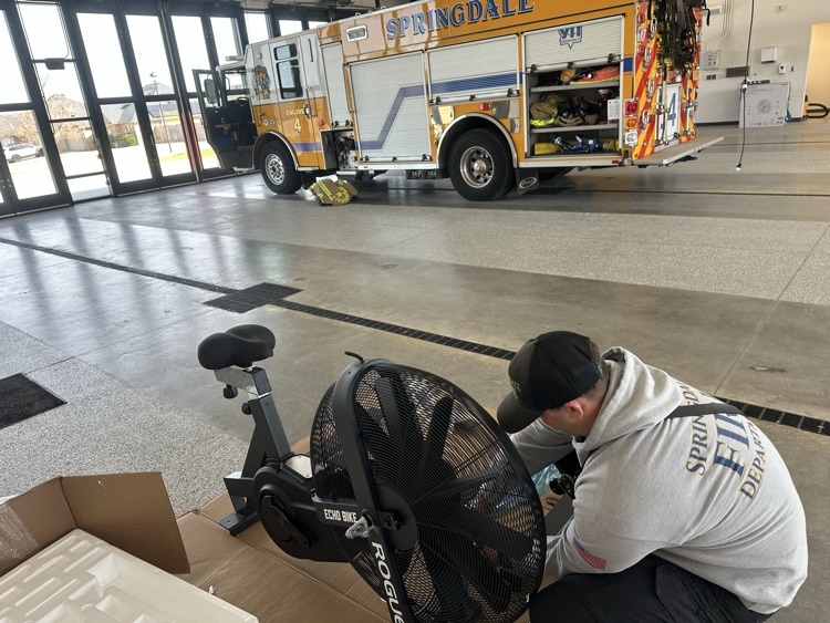 firefighter putting together work out bike